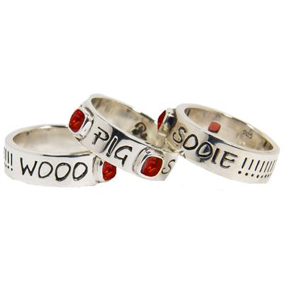 Woo Pig Sooie band ring with red stones.                                                                                                                                                                                                                  