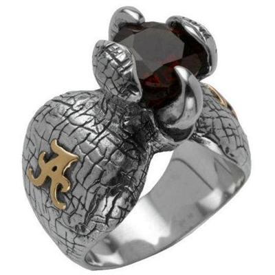 Sterling silver Alabama ring with garnet and tusk prongs.                                                                                                                                                                                                 
