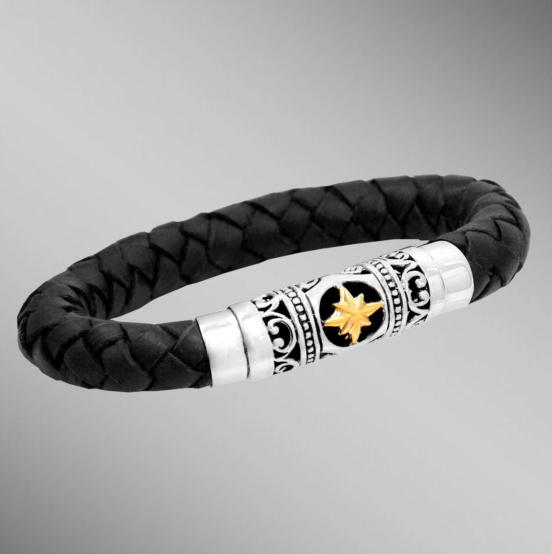 Braided black leather bracelet with gold 8-point star.  Arista.                                                                                                                                                                                           