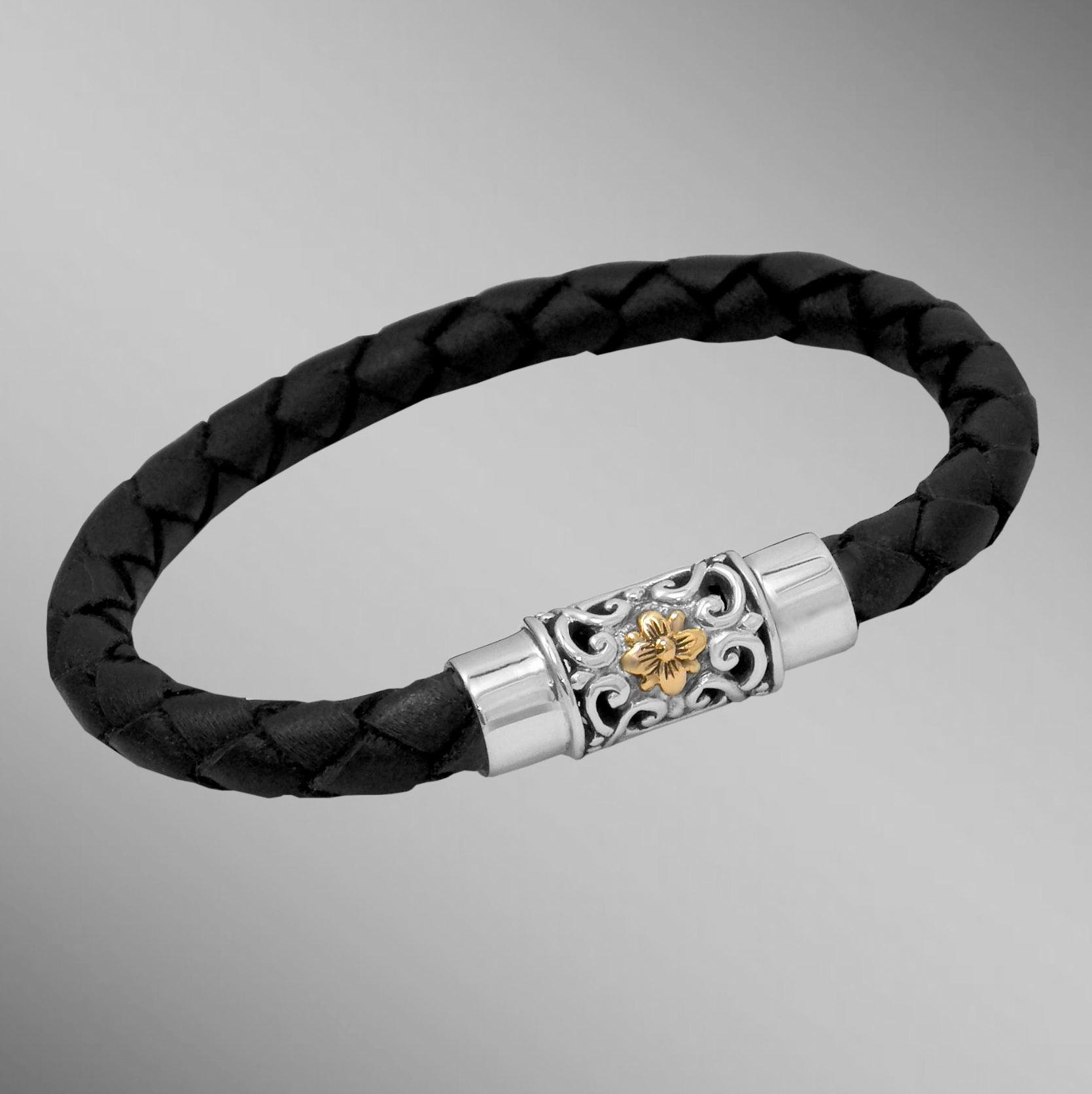 Black woven leather bracelet with gold flower on silver clasp.  Arista.                                                                                                                                                                                   