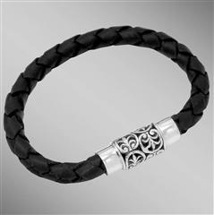 Black braided leather bracelet with silver anthemion motif clasp. Arista.                                                                                                                                                                                 
