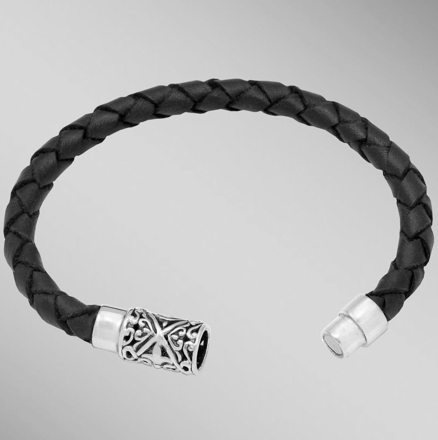 Black woven braided leather bracelet with silver magnetic clasp.  Arista.                                                                                                                                                                                 