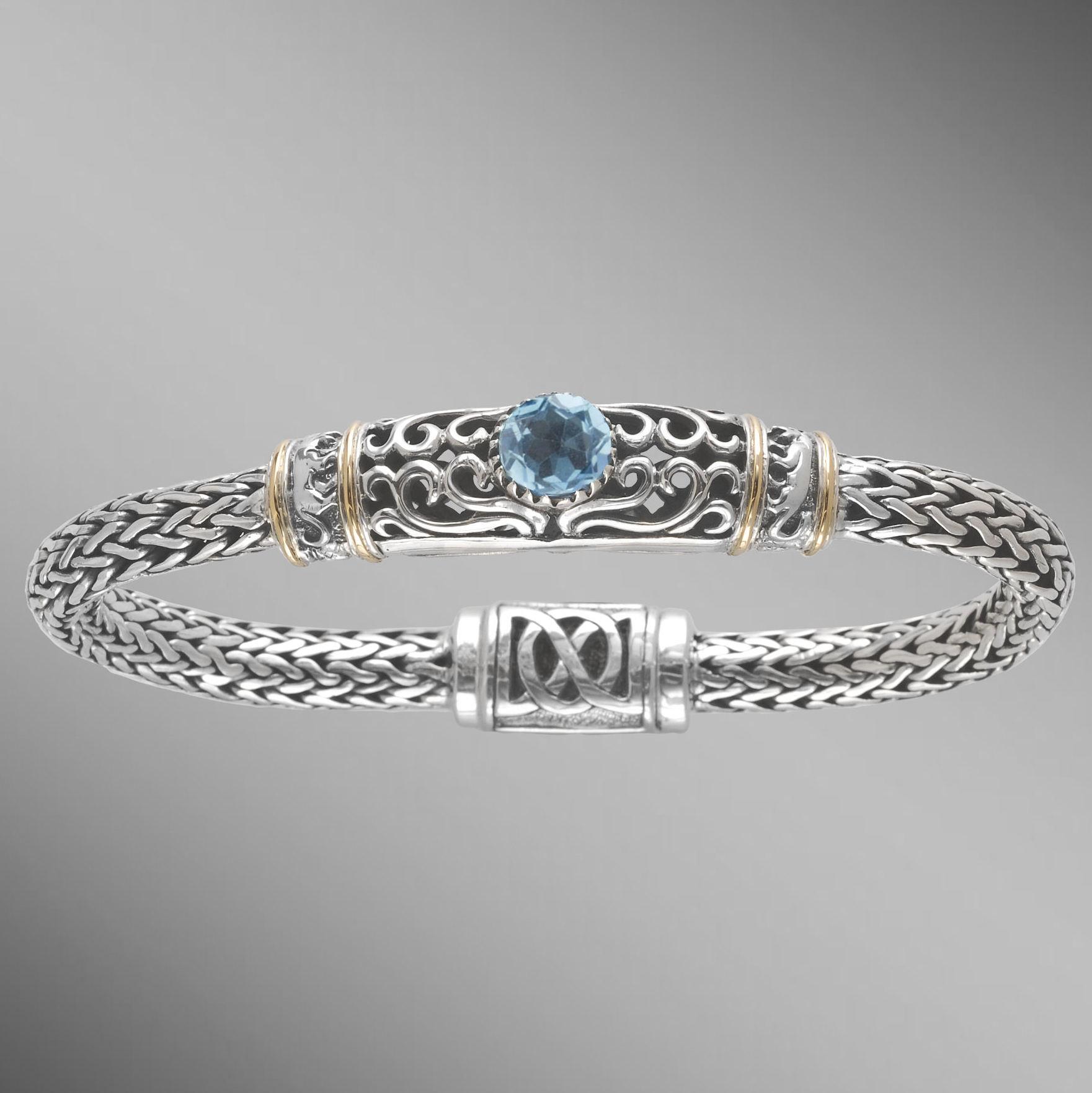 Sky blue topaz sterling silver woven bracelet with gold.                                                                                                                                                                                                  