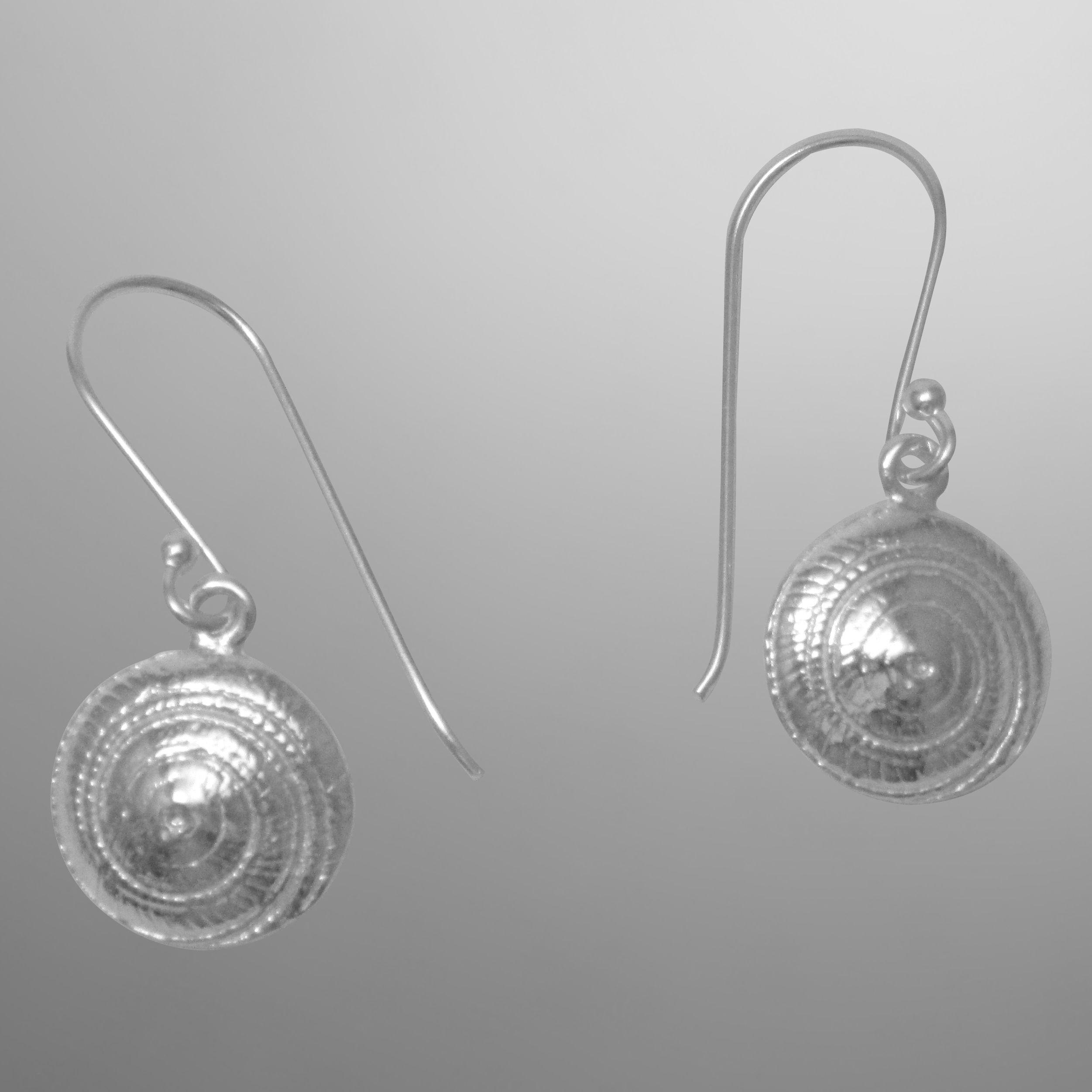 Hypnotic spiral moon shells in sterling silver on hooks.                                                                                                                                                                                                  