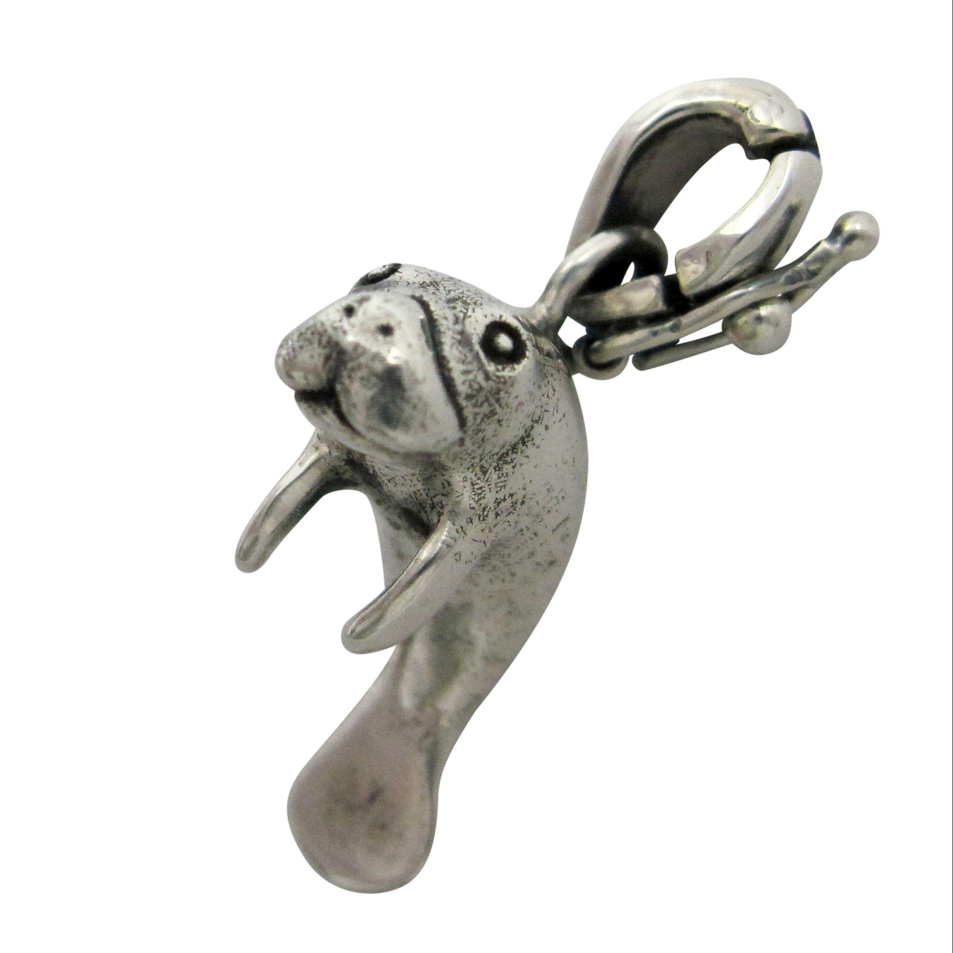 Silver manatee pendant charm.                                                                                                                                                                                                                             