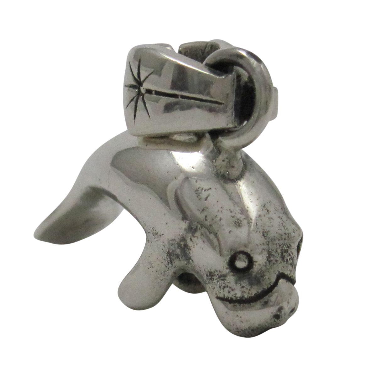 Silver manatee pendant charm.                                                                                                                                                                                                                             