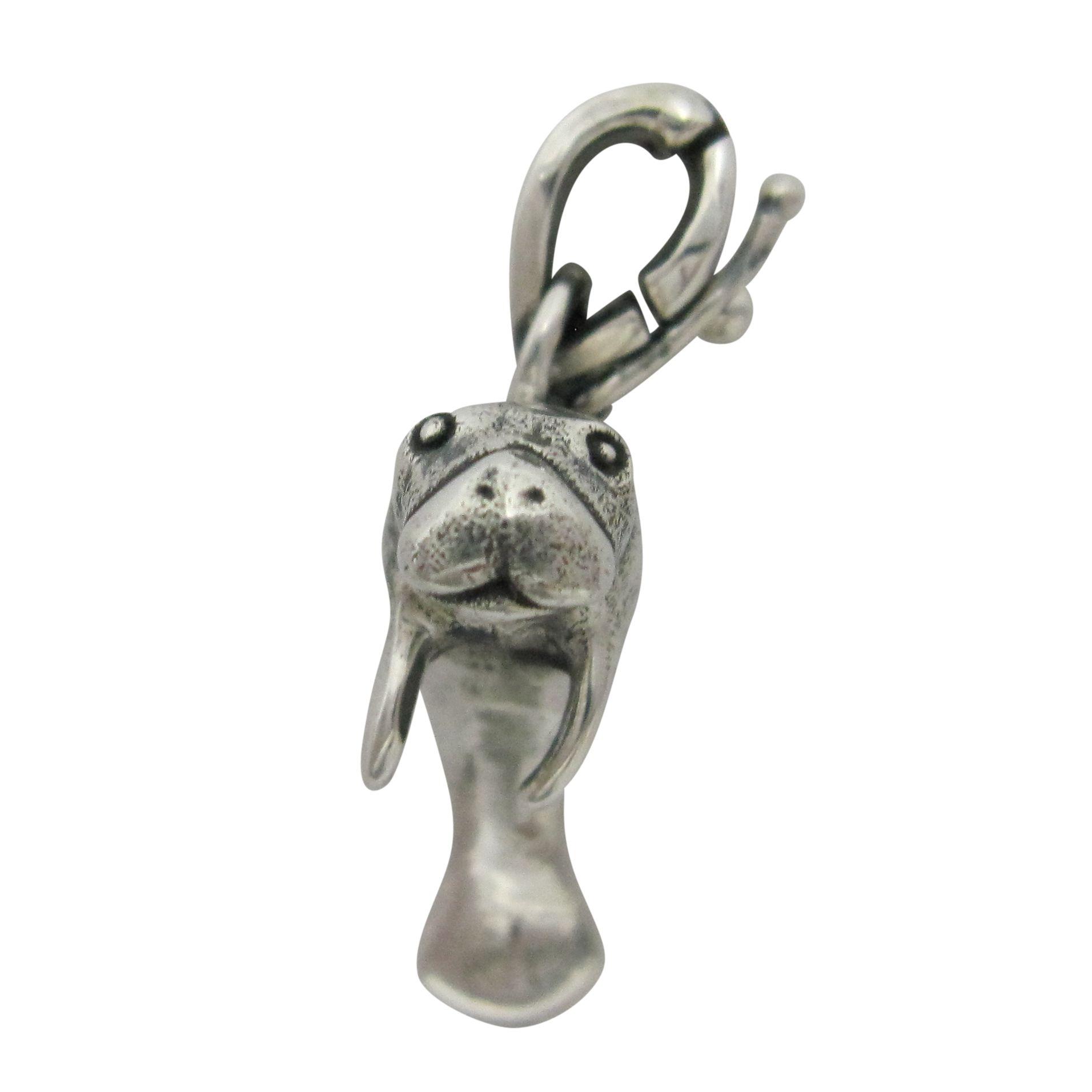 Silver manatee pendant charm.                                                                                                                                                                                                                             