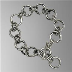 Sterling silver tusk hoop bracelet.                                                                                                                                                                                                                       