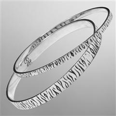 Sterling silver tiger stripe bangle bracelets.                                                                                                                                                                                                            