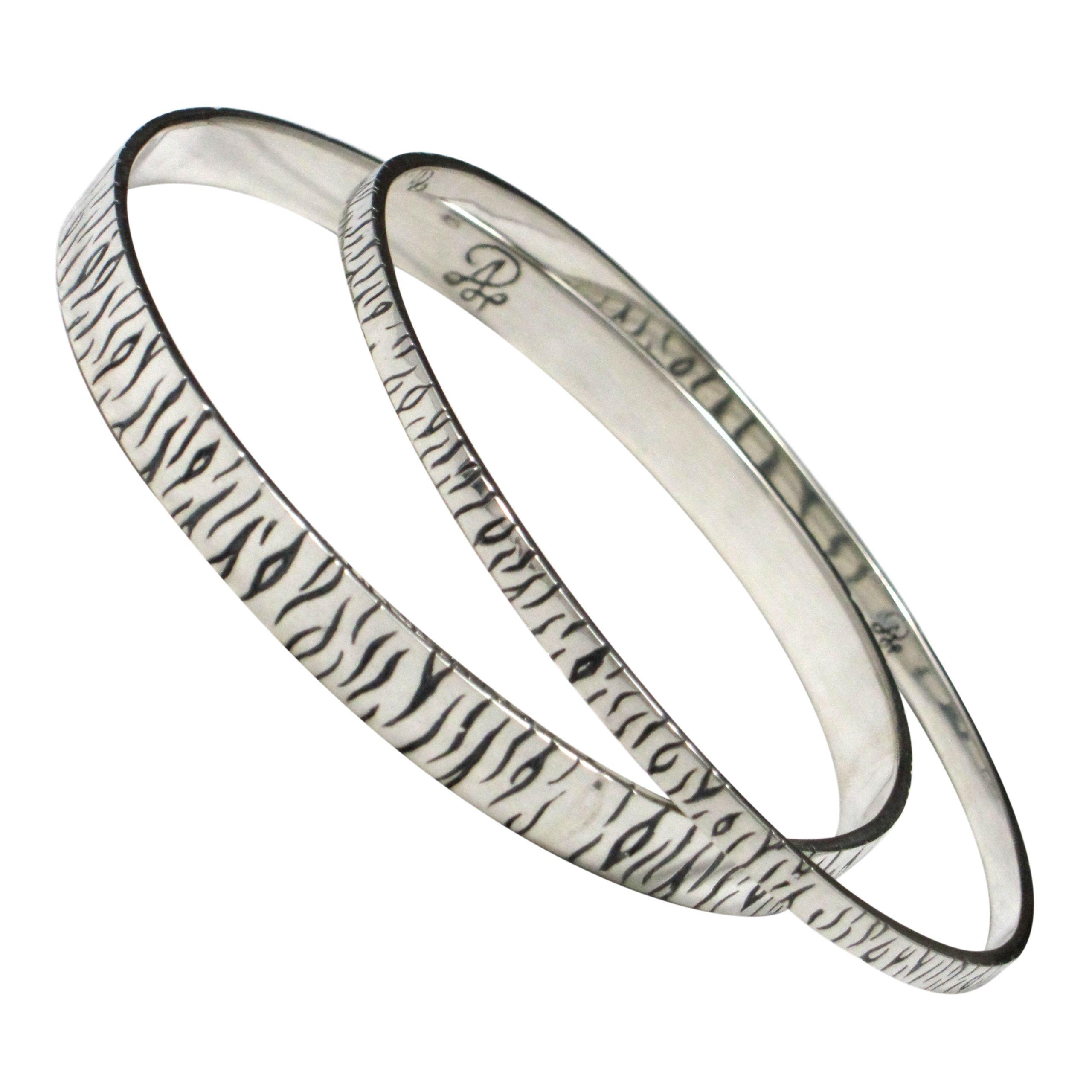 Sterling silver tiger stripe bangle bracelets.                                                                                                                                                                                                            