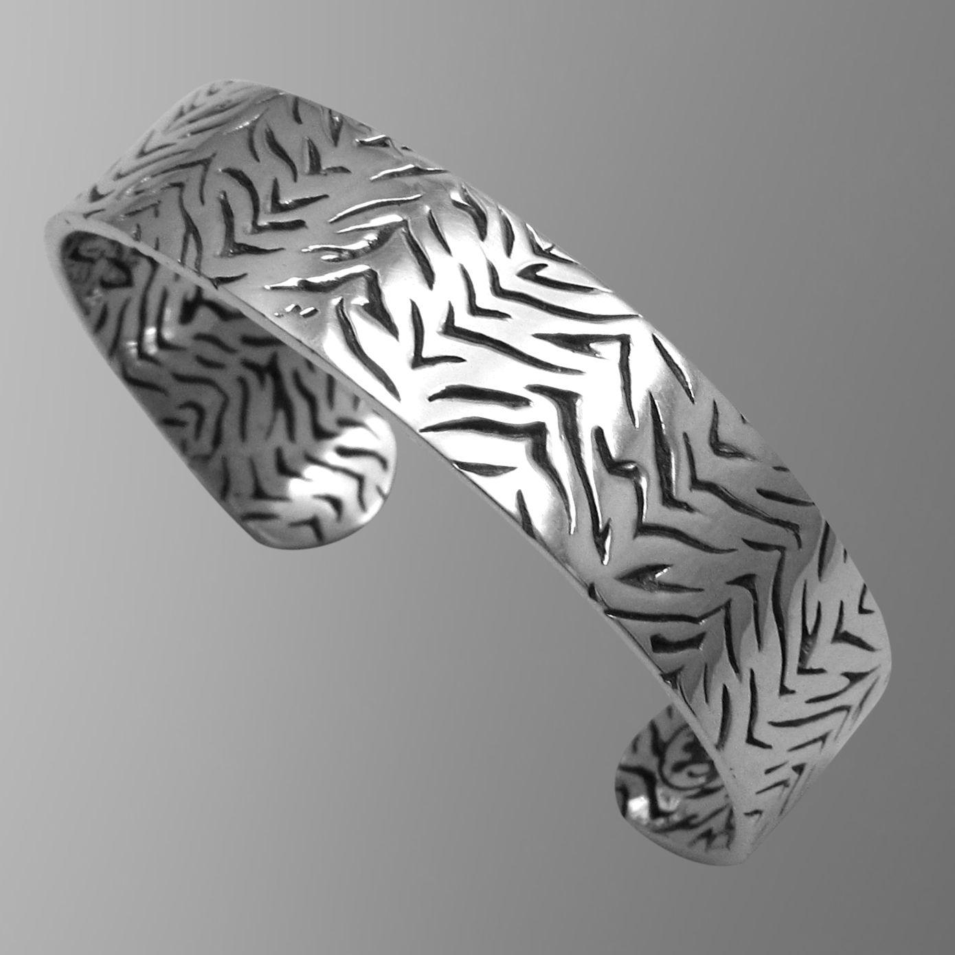 Sterling silver tiger cuff.                                                                                                                                                                                                                               