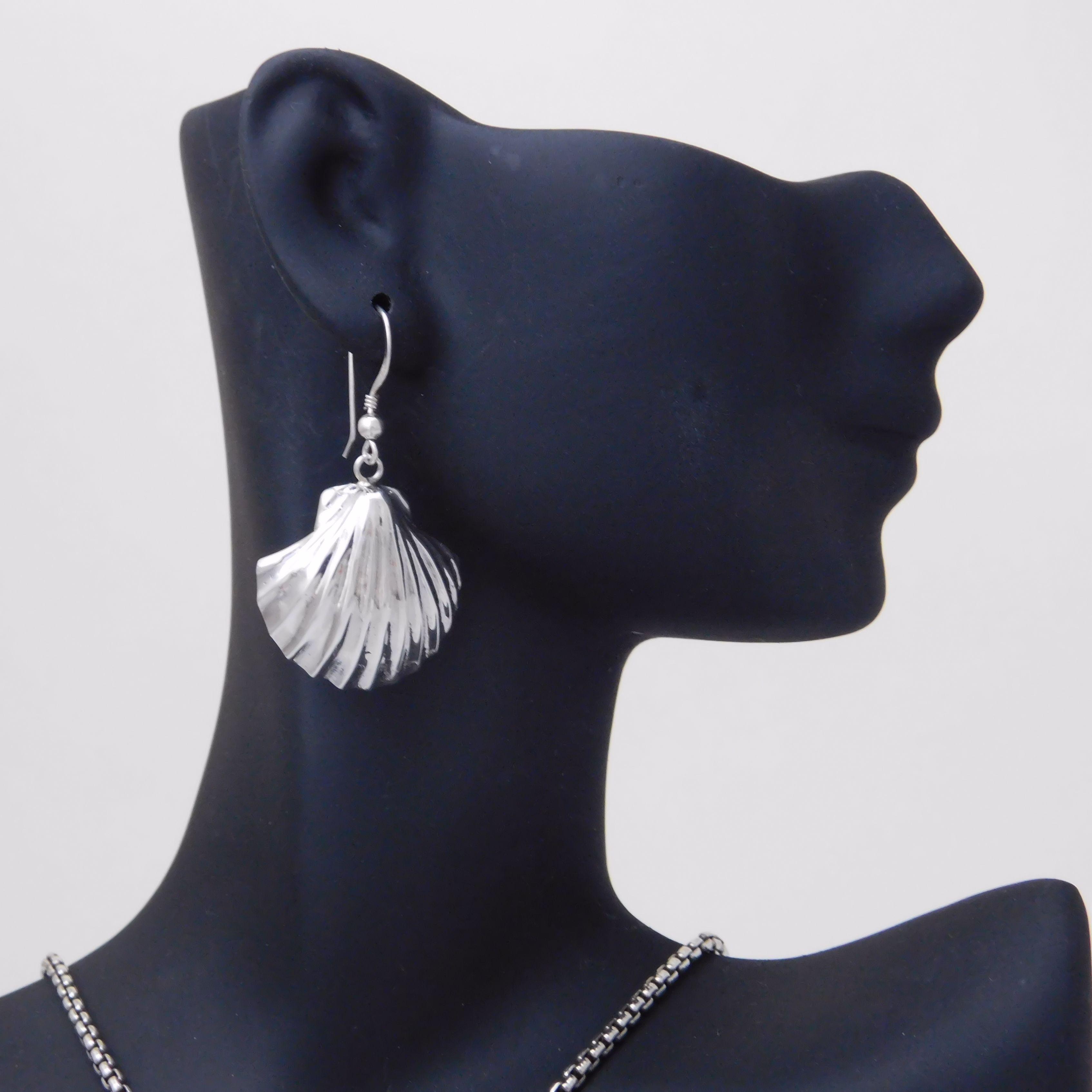 Sterling silver large scallop shell earrings.                                                                                                                                                                                                             