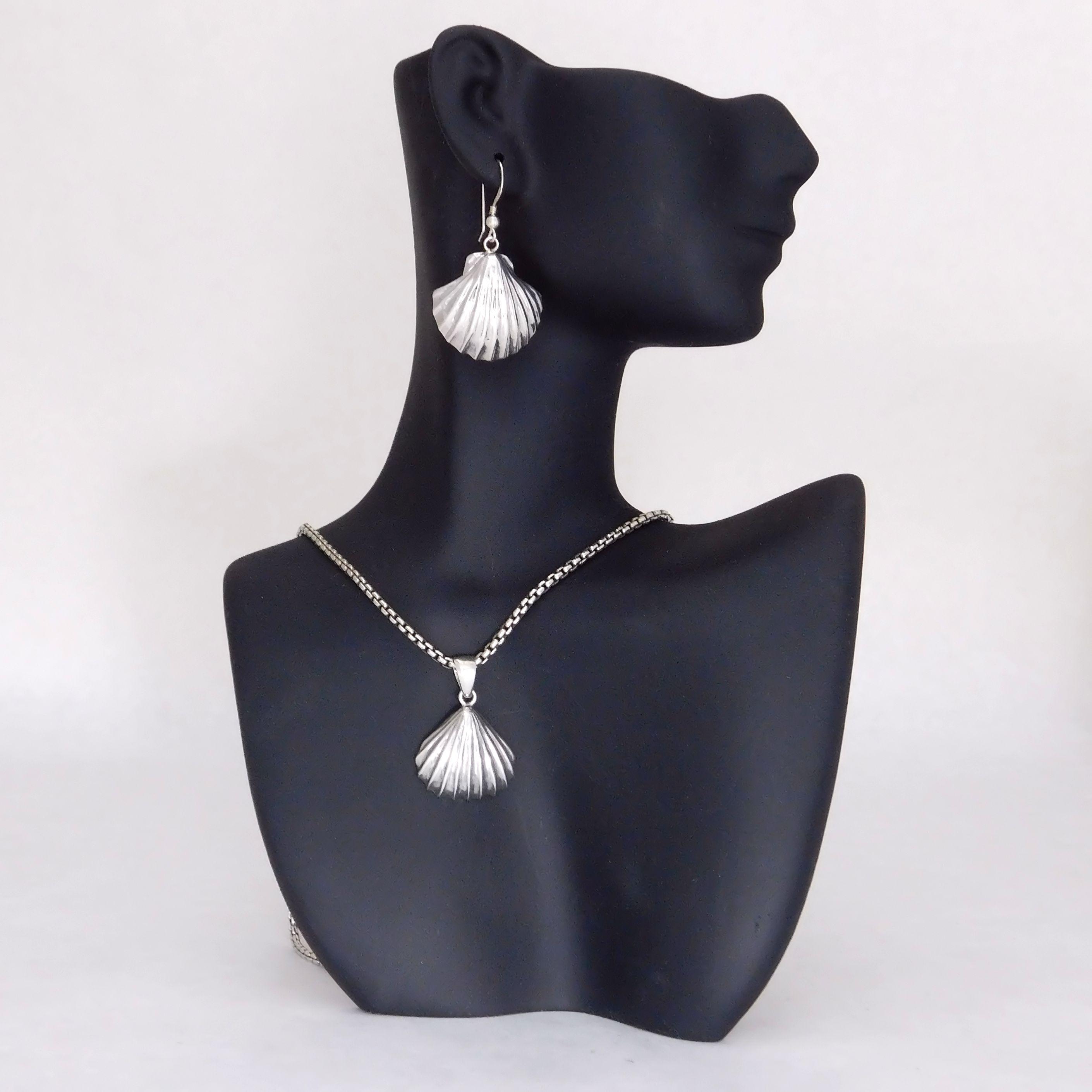 Matching silver scallop necklace pendant and earrings.                                                                                                                                                                                                    