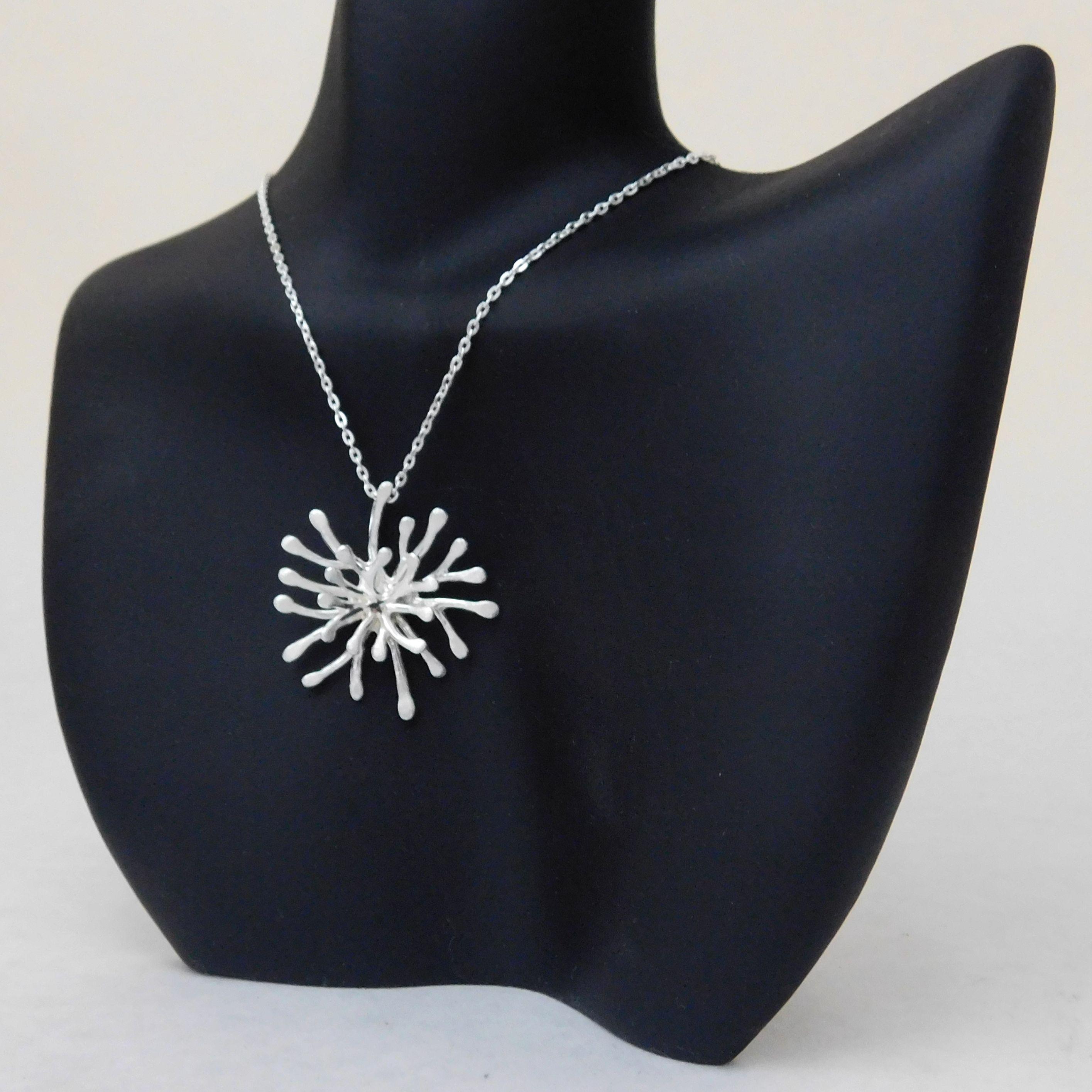 Sterling silver coral design necklace with large round branch coral pendant.                                                                                                                                                                              