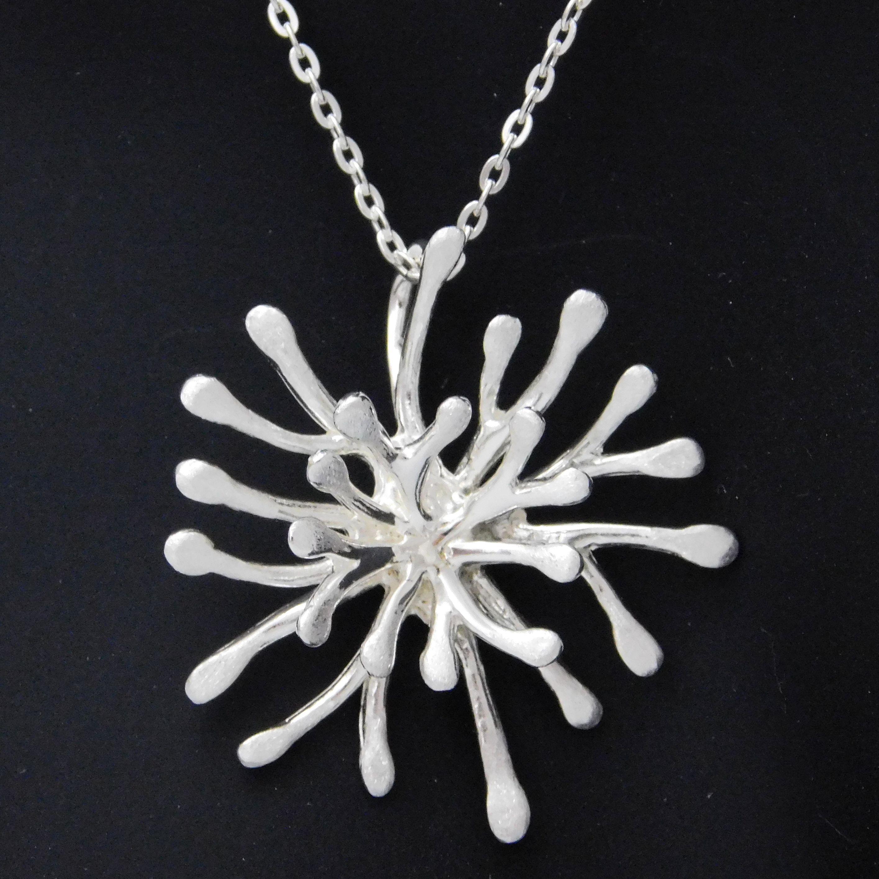 Bright silver coral flower necklace.                                                                                                                                                                                                                      